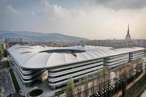a large building with a domed roof in a city at A Casa Romar in Turin