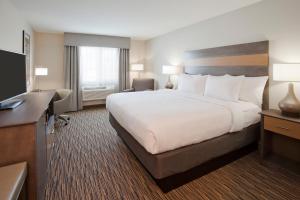 Ένα ή περισσότερα κρεβάτια σε δωμάτιο στο Grandstay Hotel Milbank