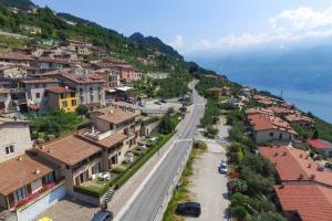 a view of a town on a mountain at Residence Calap in Tignale