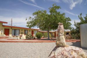 a statue of a woman sitting on a rock at Harmony Motel in Twentynine Palms
