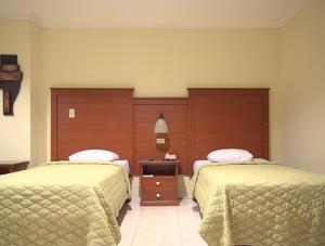 Rúm í herbergi á Hotel Castilla