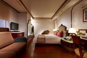 Tempat tidur dalam kamar di Charming City Songshan Hotel