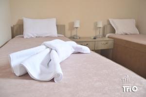 Letto o letti in una camera di Garni Hotel Tri O