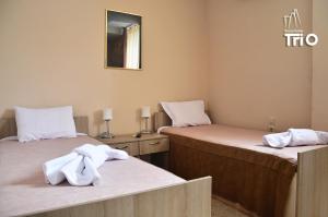 Letto o letti in una camera di Garni Hotel Tri O