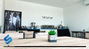 a table with a potted plant sitting on top of it at The S24 Resort Buriram in Buriram