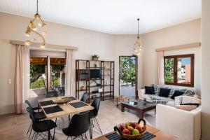 a living room with a couch and a table at Lila hill house in Stalos