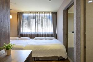 Postel nebo postele na pokoji v ubytování 綺樂文旅 康定館 Le Room Hotel Kangding
