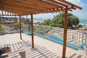 a balcony with a view of the ocean at Casa Azul in Pipa