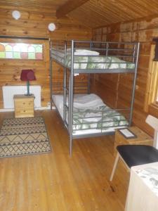 a bunk bed room with two bunk beds in a cabin at Råda Stugor in Råda +6 photos