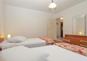 Postel nebo postele na pokoji v ubytování Apartment 1686