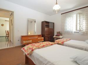 Postel nebo postele na pokoji v ubytování Apartment 1686