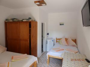 En eller flere senge i et værelse på Tourist Paradis Costinesti