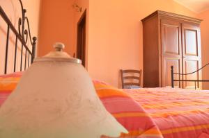 A bed or beds in a room at Agriturismo S´Aranada