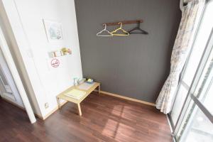 a small room with a table and a window at Luxes Hiroshima4F ラクセス ヒロシマ4F in Hiroshima