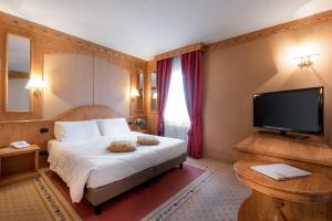 TV a/nebo společenská místnost v ubytování Hotel Rendez Vous