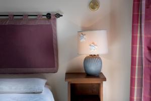 A bed or beds in a room at Hotel Rendez Vous