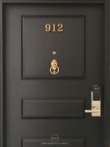 a black door with the number on it at Stay in Style at Nimman R912 in Chiang Mai