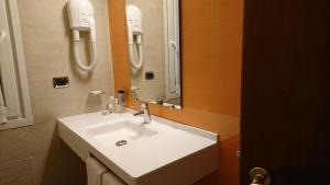 Koupelna v ubytování Hotel Confine