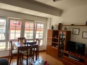 TV a/nebo společenská místnost v ubytování Apartamento Laura