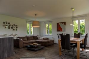 a living room with a couch and a table at An der Günz in Waldstetten