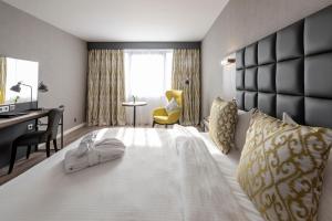 Postel nebo postele na pokoji v ubytování Gresham Belson Hotel Brussels