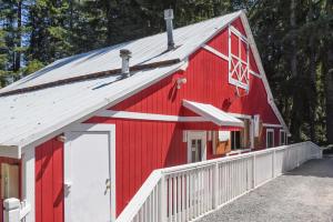 a red barn with a white at Thunderbird One-Bedroom Cabin 6 in Monroe