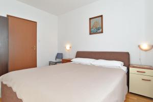 Postel nebo postele na pokoji v ubytování House Premantura 1096