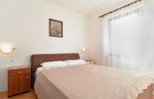 Postel nebo postele na pokoji v ubytování House Premantura 1096