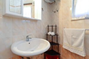 Koupelna v ubytování House Premantura 1096
