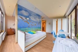 Posteľ alebo postele v izbe v ubytovaní Apartamenty Sun & Snow Żeromskiego Krynica Morska - blisko morza