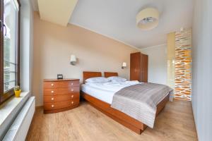 Posteľ alebo postele v izbe v ubytovaní Apartamenty Sun & Snow Żeromskiego Krynica Morska - blisko morza