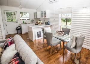 a living room with a couch and a table at Valmont Estate in Plettenberg Bay