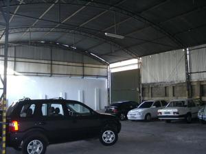 a group of cars parked in a garage at Hotel Aliança in São Lourenço