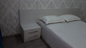 Postel nebo postele na pokoji v ubytování Apartment on Metallurgov 32
