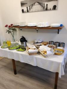 a white table with food on top of it at Pension Avio Angels in Žiar nad Hronom