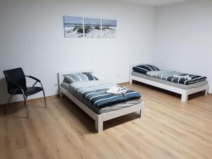 Ένα ή περισσότερα κρεβάτια σε δωμάτιο στο Monteurzimmer Obersulm