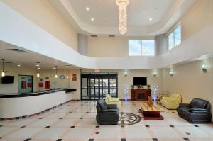 The lobby or reception area at Ramada by Wyndham South Waco