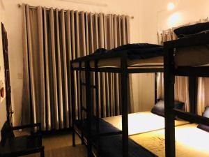 Postel nebo postele na pokoji v ubytování Friendly House Homestay
