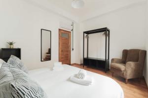 Säng eller sängar i ett rum på Puro Apartment