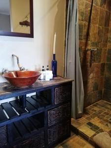 a bathroom with a sink and a shower at La Vue Guesthouse in Lanseria