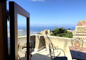 a balcony with a view of the ocean at Appartamenti Liberty in Erice