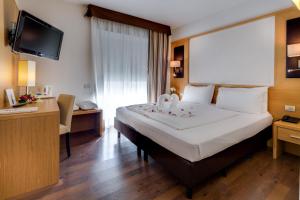 Postel nebo postele na pokoji v ubytování Best Western Hotel Adige