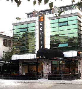 a building with a sign on the front of it at Double Bond Hotel Spa in Ankara