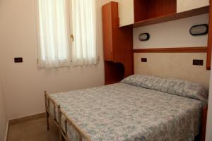 Postel nebo postele na pokoji v ubytování Hotel Parigi