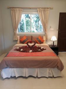 Ein Bett oder Betten in einem Zimmer der Unterkunft Bussarin Mansion