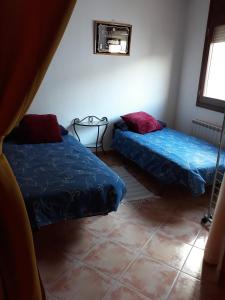 Postel nebo postele na pokoji v ubytování Loft Castelló