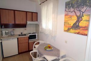 Kuchyň nebo kuchyňský kout v ubytování House Dimitri Agios Georgios Pagoi Corfu + 37 fotografií