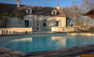 a large swimming pool in front of a house at LA PETITE NOUE in Vignoux-sous-les-Aix