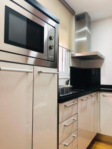Kuchyň nebo kuchyňský kout v ubytování Apartamento Malagueta