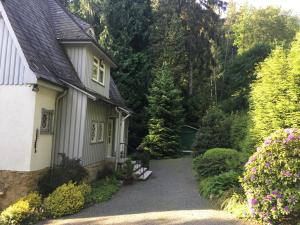 a small house with a pathway leading to it at Villa Elfenstein in Bad Harzburg